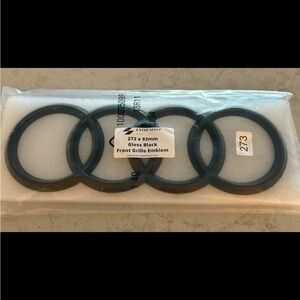 Enthusiast Brand Gloss Black Front Grille Emblem for an Audi.